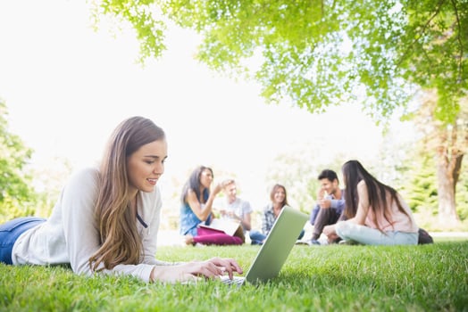 Gen Z Working on Laptops Outside Blog Header