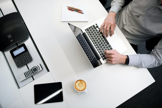 Man typing on a laptop